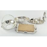 A collection of assorted silver plated wares, including a cruet set, sugar castor,