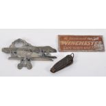 A vintage aluminium sign 'We recommend and sell Winchester cartridges and guns',