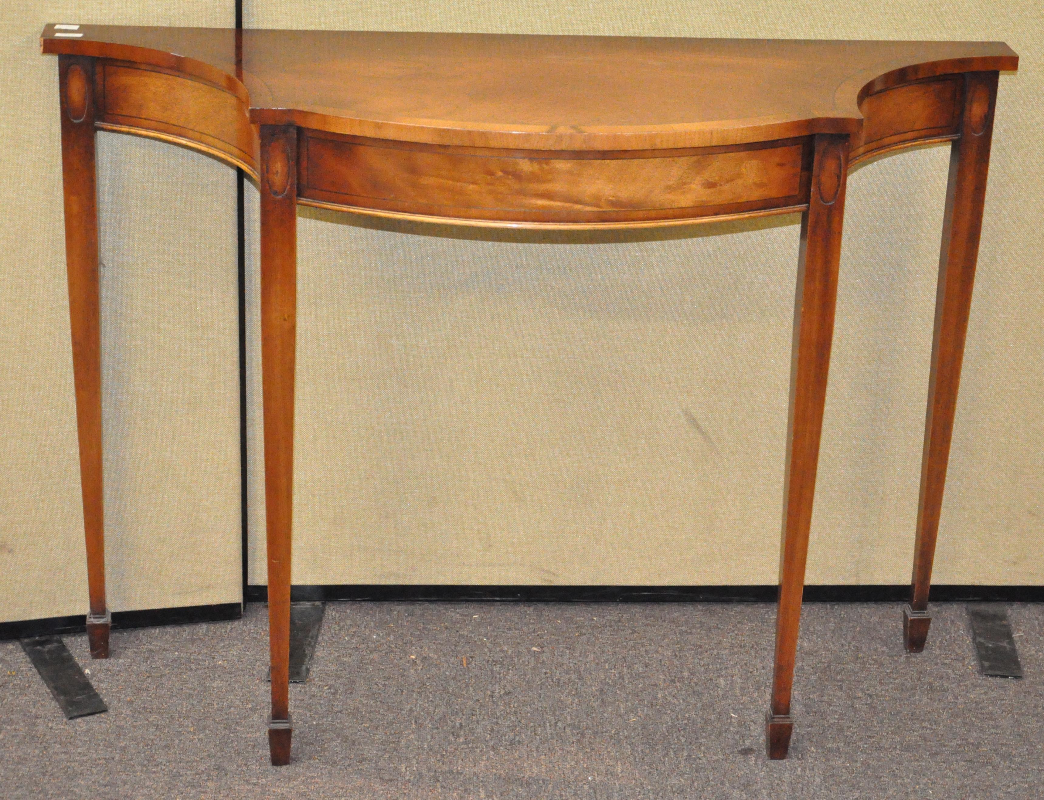 A reproduction serpentine pier table,