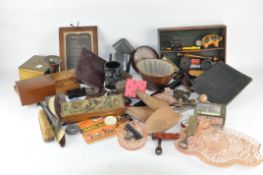 A leather suitcase containing various vintage items,