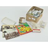 A group of assorted items, including cigarette cards,