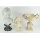 Two white resin busts of females, each raised on a pedestal base,