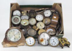 An extensive collection of clock movements and dials (2 boxes)