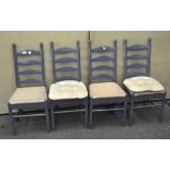 A set of four blue painted kitchen chairs, upholstered in a 100% cotton fabric,