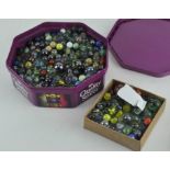 A collection of approximately 550 marbles of varying sizes and designs