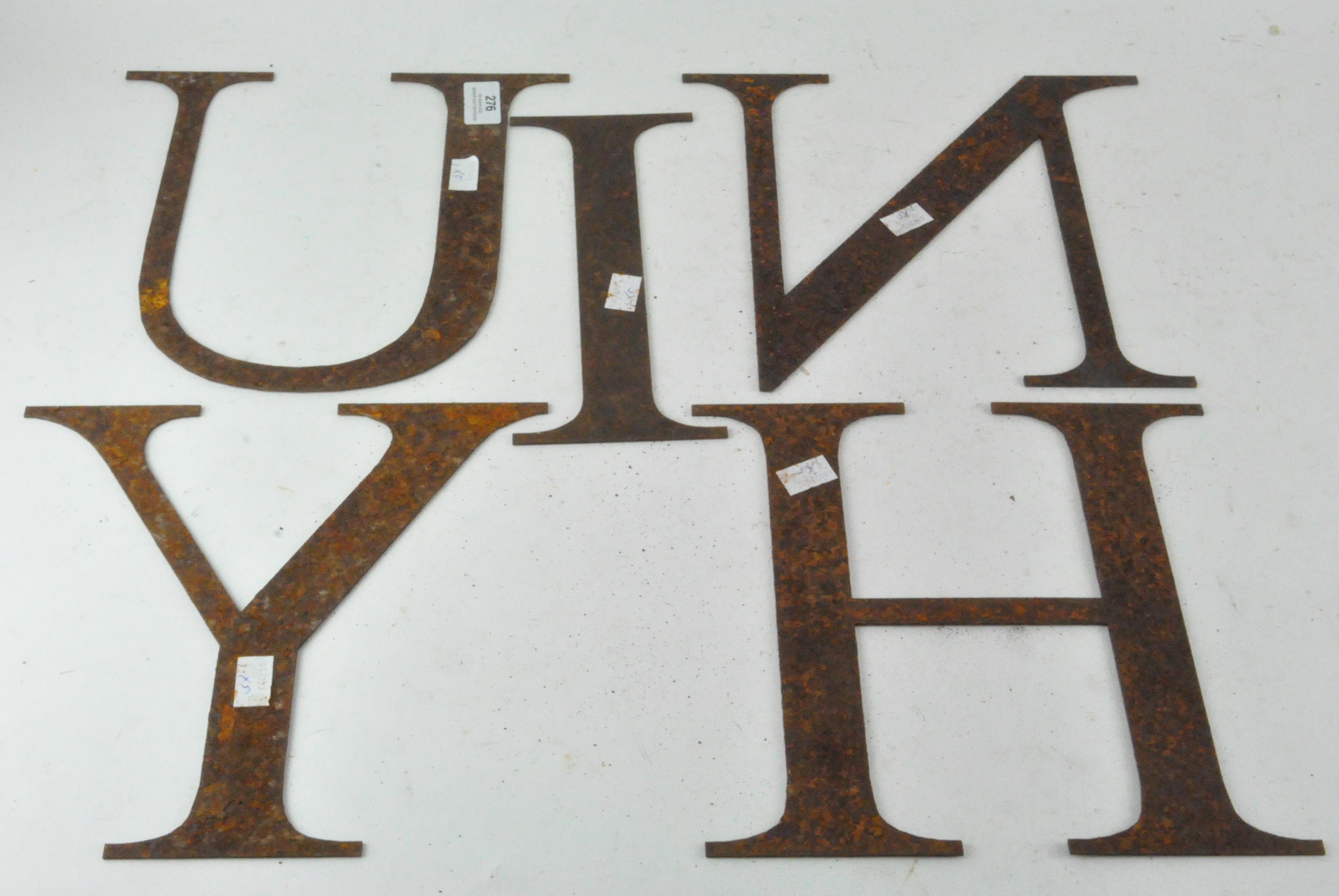 A group of five early metal wall letters, comprising; I, N, H, U and Y,