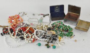 A collection of costume jewellery and a cigarette box