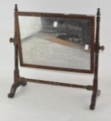 A 19th century mahogany dressing table mirror with turned supports,