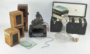 An assorted group of items, including carriage clock cases,