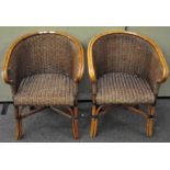 A pair of Bamboo and cane arm chairs,