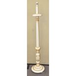 A white painted standard lamp with gilt detailing,