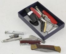 A group of vintage folding knives
