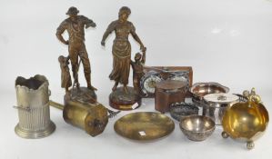An assortment of metalware, to include a pair of large figures depicting parents with children,