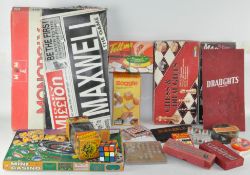 A collection of assorted board games, including a Rubik's cube,