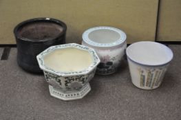 A group of four modern ceramic jardinieres, each of different designs,