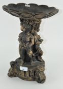 A modern resin stand depicting figures,