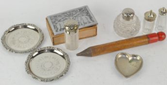 A collection of metal mounted glass casters and shakers