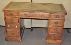 A late 19th/early 20th century oak panelled pedestal desk in three parts,