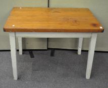 A 20th century kitchen table pine topped with white painted legs,