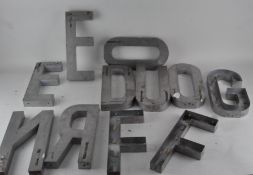 Vintage aluminium shop lettering