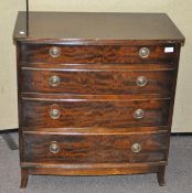 A mahogany George III style bow fronted four drawer chest,