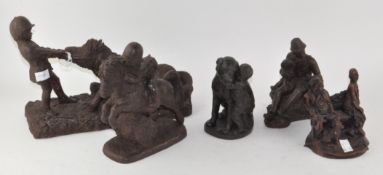 A collection of resin sculptures including people and horses,