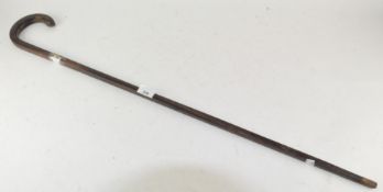 A vintage walking cane with silver collar (A/F)