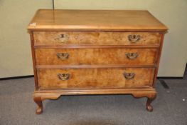 A walnut three drawer chest,