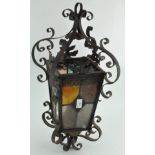 A vintage metal framed hanging lantern with glass panelling,