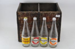 A group of 1960's Corona pop bottles with original Coronal wooden crate