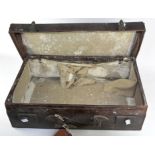 A vintage distressed leather suitcase,