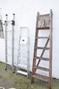 One extending metal ladder,