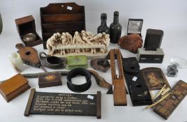 A collection of assorted items, to include a desk tidy, resin 'Last Supper' sculpture, bottles,