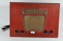 An unusual vintage red Murphy radio of wedge form, patent pending,