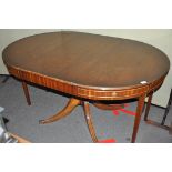 An unusual mahogany pedestal dining table, with folding legs,