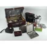 A large collection of assorted items, including a pair of binoculars, silver spill vase,
