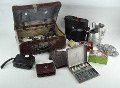 A large collection of assorted items, including a pair of binoculars, silver spill vase,