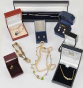 An assortment of costume jewellery, to include silver chains with pendants,