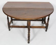 An oak gateleg dining table, 18th century and later,