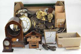 Two boxes of clocks and parts, including a cuckoo clock,