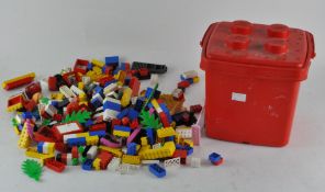 A collection of assorted Lego in a red Lego brick storage box