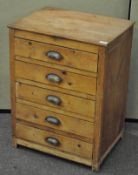 A 20th century vintage pine chest of drawers with 'd' cup handles and bank of five drawers,