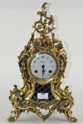 A modern gilt mantel clock in the rococo style, retailed by Robert Grant of London,