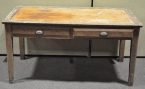 A large oak and pine two drawer desk,