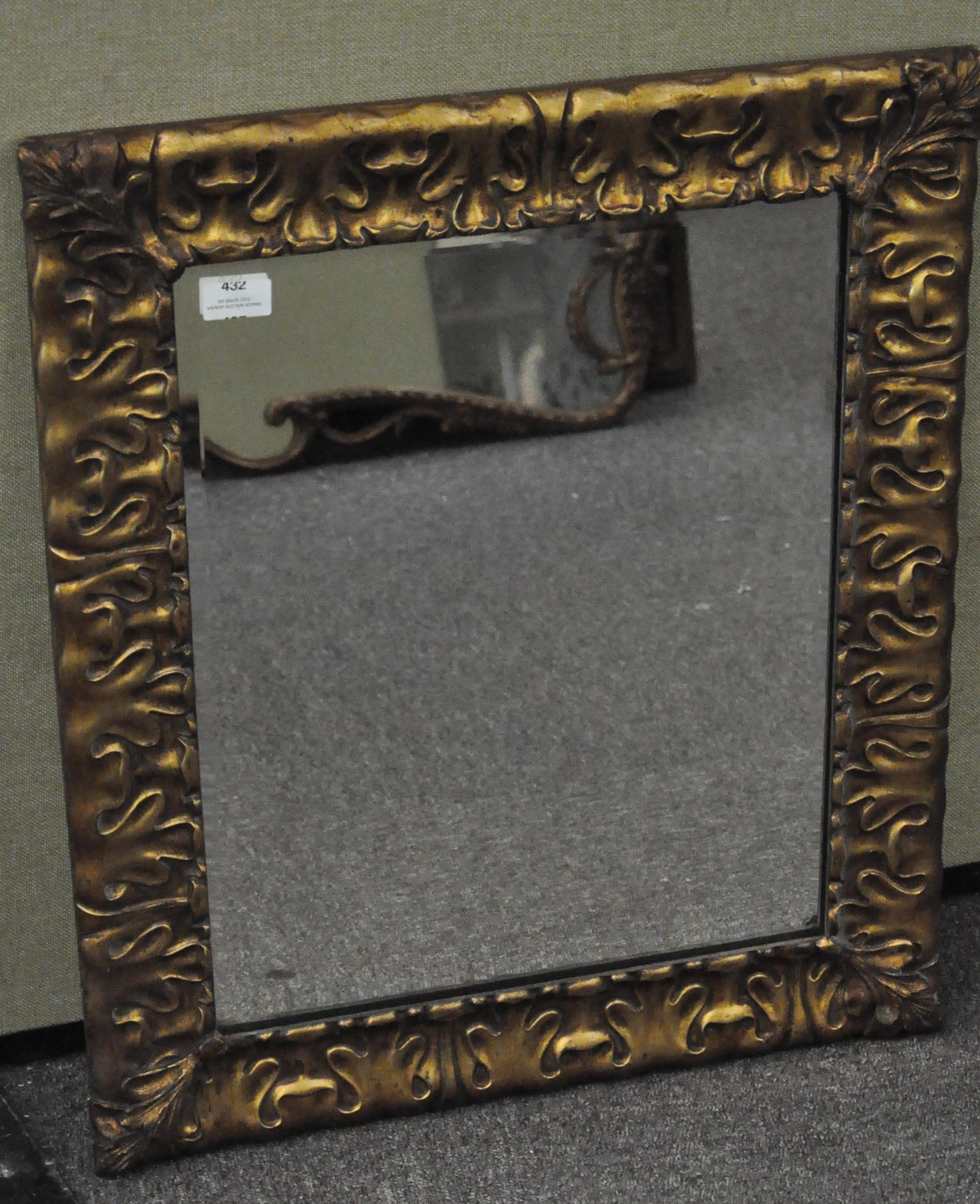 An early 20th century giltwood framed wall mirror with bevelled edge,