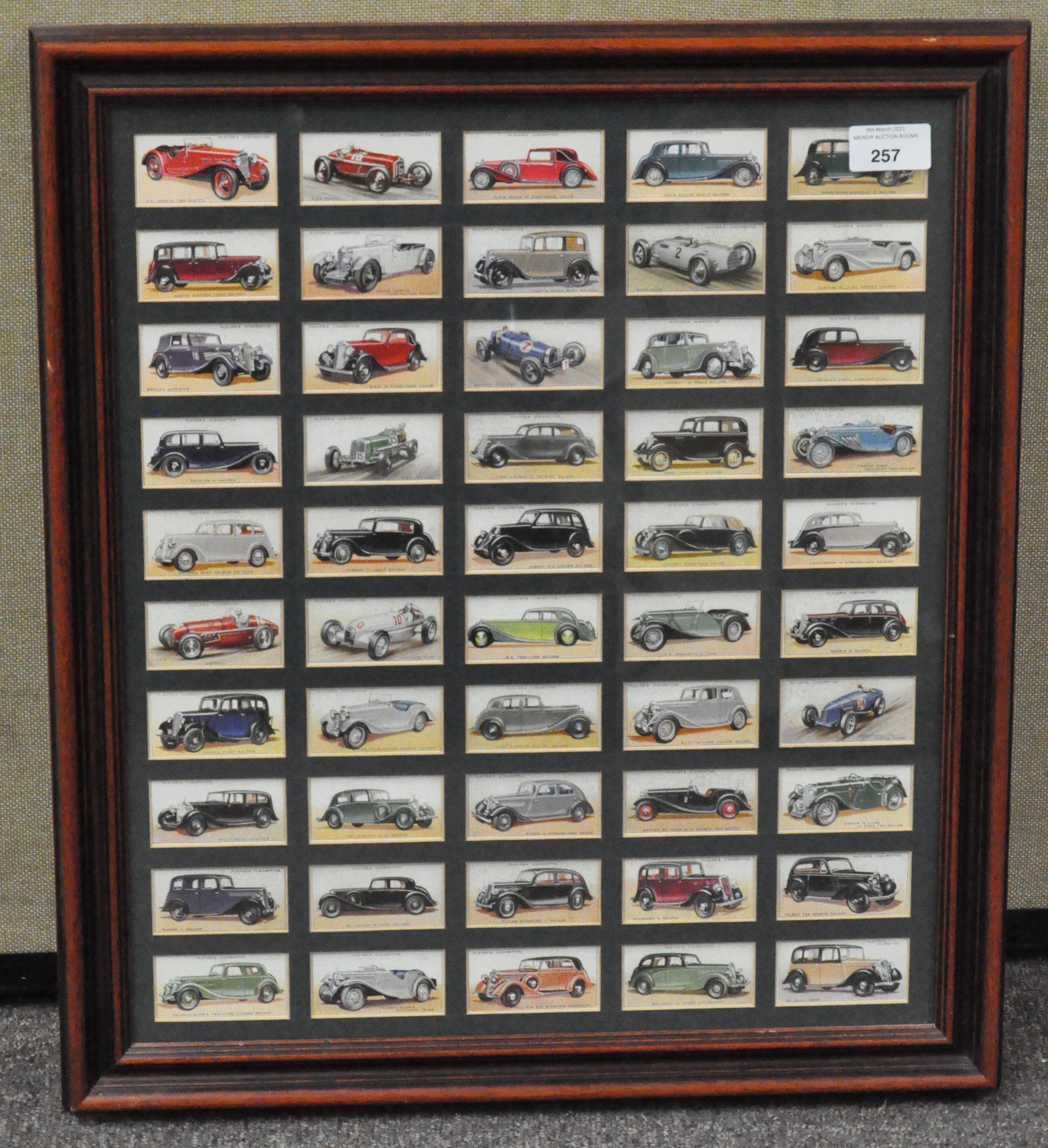 A framed and glazed set of Players "motor cars" cigarette cards, full set,