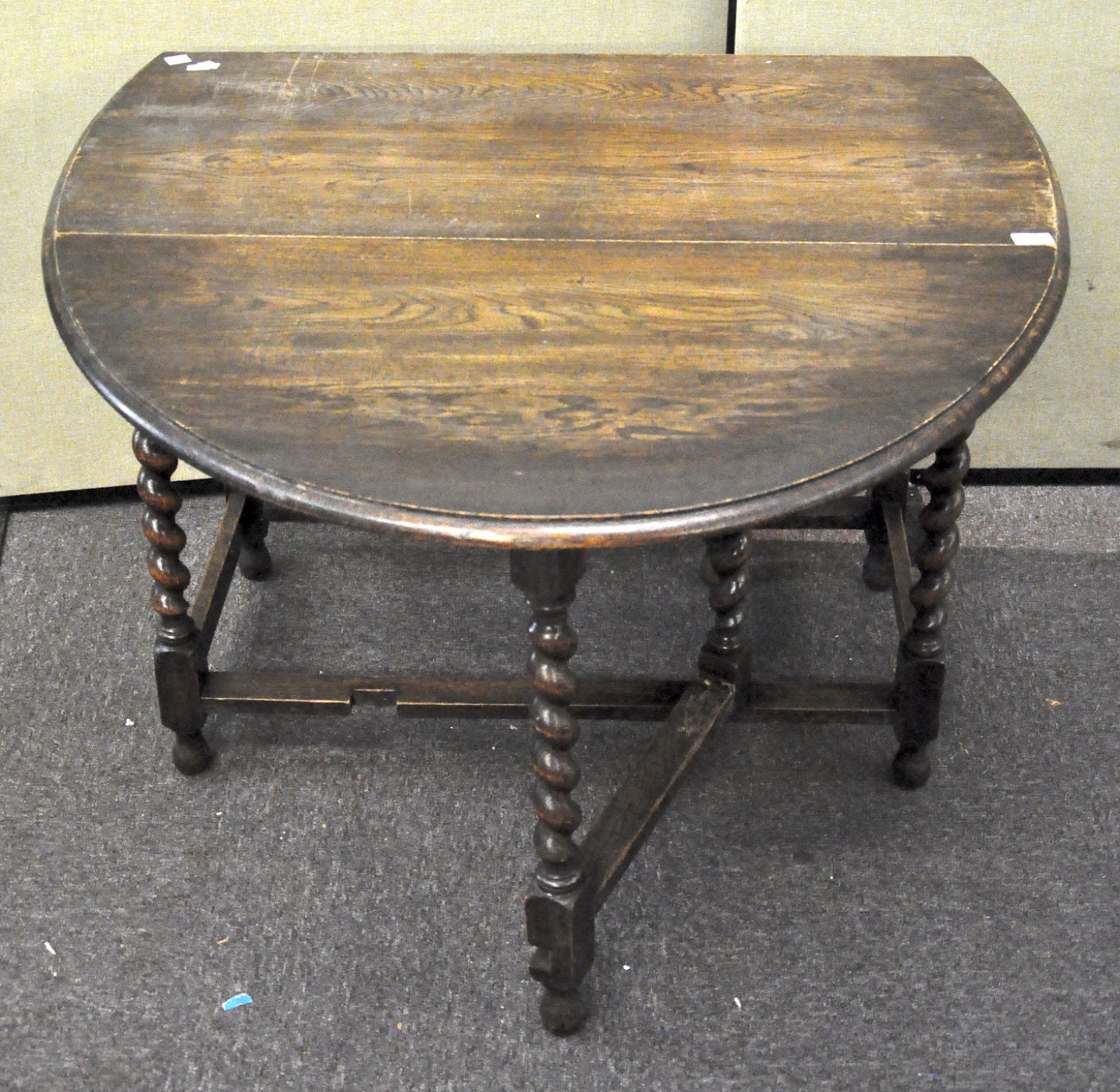 An oak barley twist drop leaf table, 73cm x 104cm x 54cm.