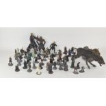 A collection of Lord of the Rings metal and resin figures with books,