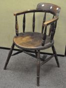 A 20th century oak tub chair,