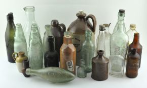 A collection of vintage glass bottles and stoneware flagons,